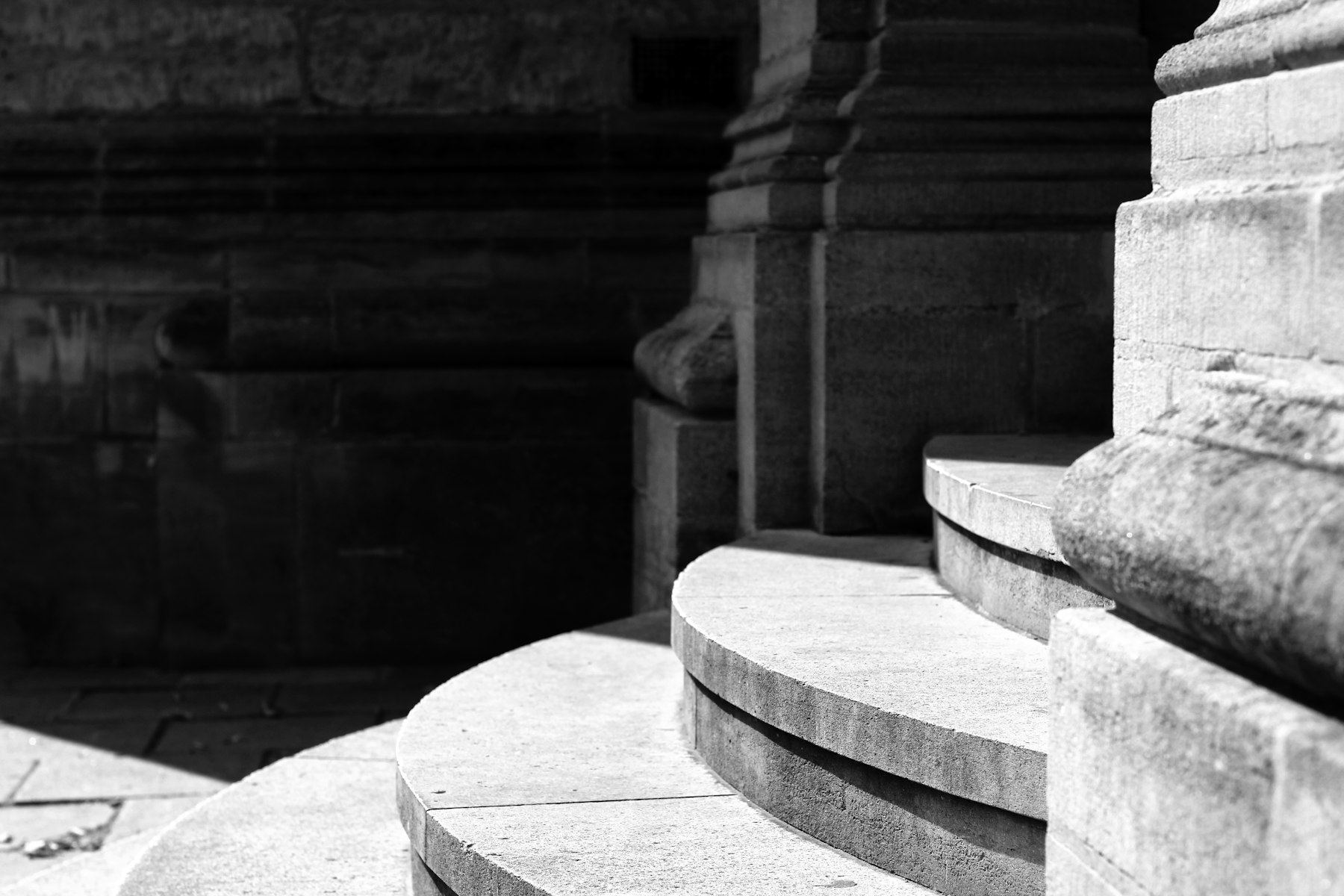 Stone steps and columns in raking light.